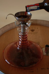 Decanting a bottle of red wine Magic Mountain 2015